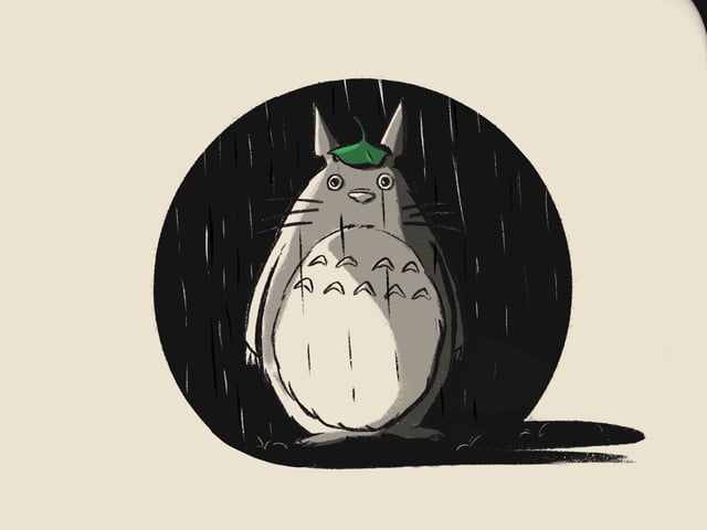 Totoro standing beneath a leaf against a dark circular background.
