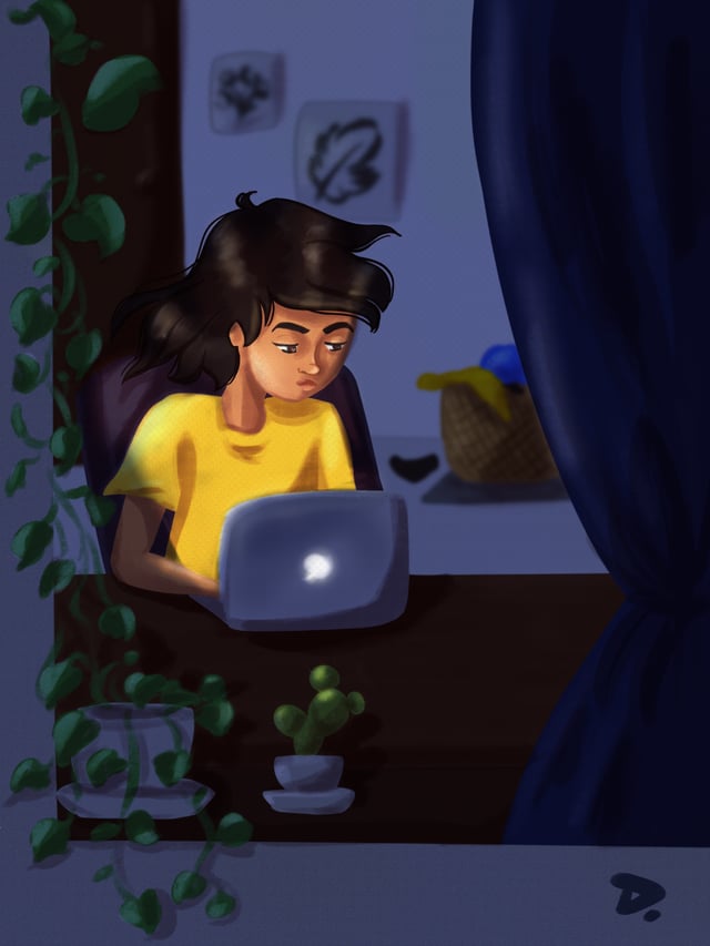 Woman in a yellow shirt working on a glowing laptop in a dark room surrounded by plants.